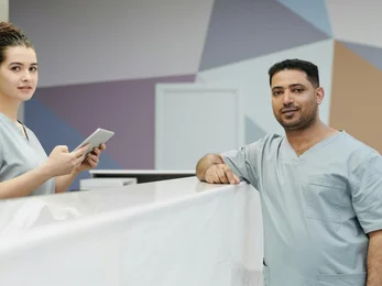 Women and men on desk