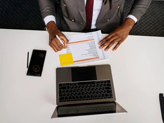 Men writing on paper